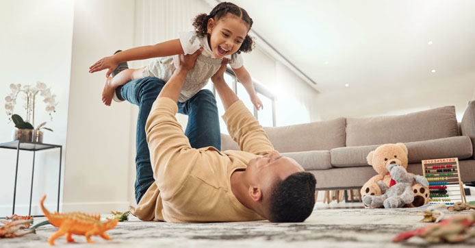 Image showing a father and girl playing in a house with freedom